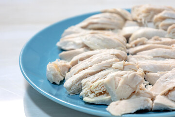  boiled chicken meat on blue plate