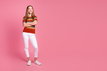 Full body photo of nice creative minded girl folded arms look empty space isolated on pink color background