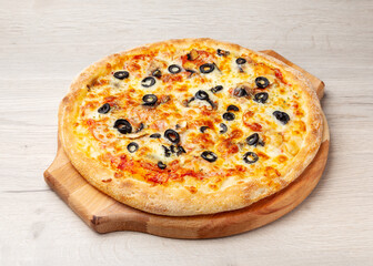 Italian pizza with tomato, cheese and olives on a wooden board