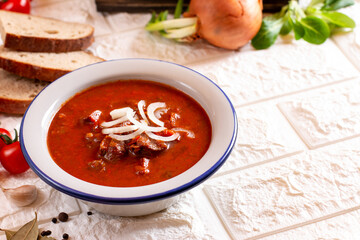 Hungarian goulash soup bograch on the table. horizontal. Copy space