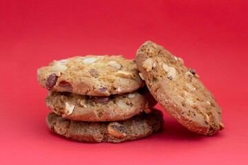 Closeup of Homemade Peanut Cookies or Biscuit Isolate on Red Background in Horizontal Orientation