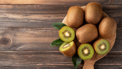 Top view tasty ripe kiwi on wooden background with copy space - Powered by Adobe