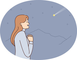 Dreaming woman with palms clasped in front of chest looks at shooting star and makes wish. Casual...