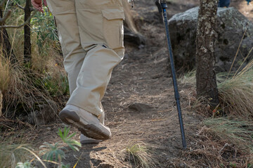 Feet of a woman hiking in the middle of the forest in Mexico