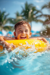 Child playing in swimming pool with colorful floating toy. Little child having fun on family summer vacation in tropical resort. Beach and water toys.