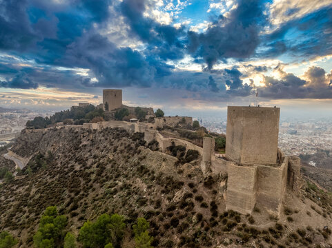 Aerial view of Lorca castle in Southern Spain covering the entire hilltop with large square keep