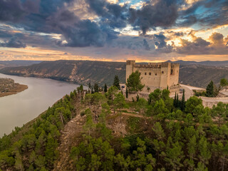 Aerial view of Mequinenza at the confluence of the Ebro between the Mequinenza Dam and Riba-roja reservoir. Fortification with angled bastions at strategic location, dramatic sky