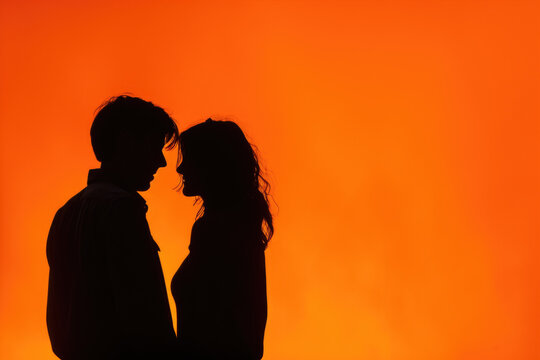 couple with a orange color and a silhouette and a professional overlay on the together