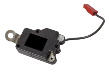 A spare part for a plastic car engine control unit in black with red elements on a white isolated background is a connecting center of subsystems, components and assemblies. Electronic ignition unit