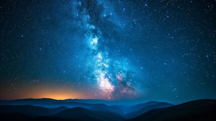 Amazing view of the night sky full of stars and a bright milky way over the mountain range
