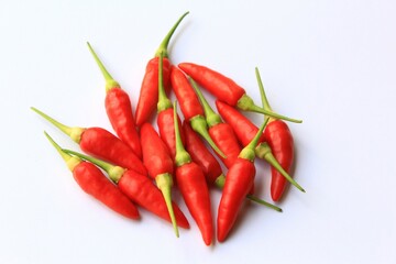 Red chili peppers or Bird's eye chili photo on white background top view 