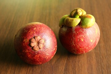 Close up skin texture mangosteen fruit, Asian fruit. photo on wooden background