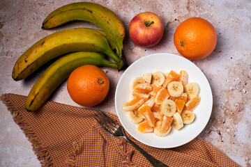 Fruit salad, orange, banana and apple