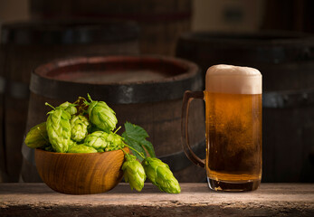 Beer barrel with beer glasses on table on wooden background. High quality photo