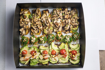 Catering boxes with delicious sandwiches.
