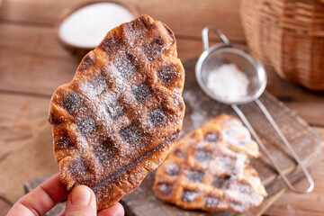 Woman take croffles, delicious breakfast. Croissant as waffle. Korean street food