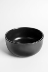 Black bowl of food on a white background