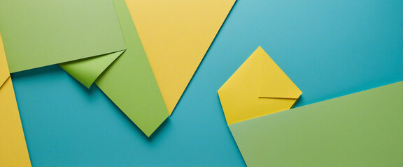 Abstract Geometric Paper Composition in Blue, Green, and Yellow Tones, Top View