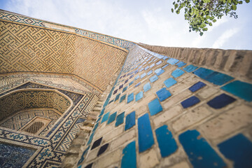 Element of the facade of a madrasah made of brick with mosaic cladding in the ancient city of...