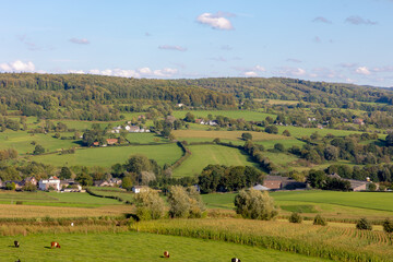 Fototapeta na wymiar Summer landscape view, Hilly countryside of Zuid-Limburg with small village on the hillside, farmland and forest, Epen is a village in the southern part of the Dutch province of Limburg, Netherlands.