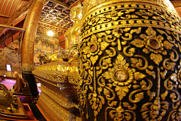 Golden buddha statue old beautiful ancient temple, Famous tourist destination at Nan province, Thailand 
