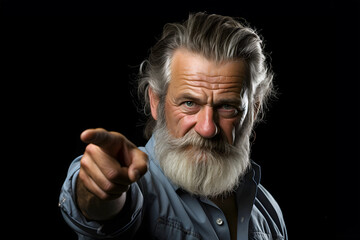portrait of a fashionable man with a white beard pointing his hand forward