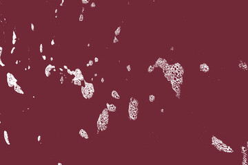 Abstract grunge wall texture white texture on puce red background.