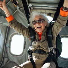 An adventurous older woman defies her age, beaming with a smile as she rides the winds in her...