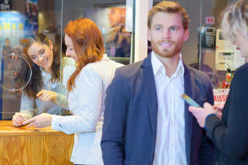 young people around ticket booth