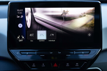 Mode button on luxury electric car dashboard. eco mode is a relaxed and comfort sport is a fuel...