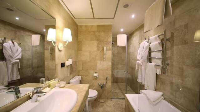 Lights turn off and turn on in the bathroom in the Hotel National