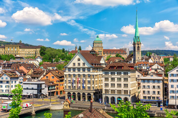 Fototapeta na wymiar Typical Swiss old architecture with Preacher's Church Tower, Limmat river by the Rudolf Brun Bridge in Zurich, Switzerland