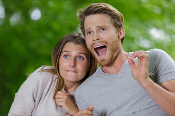 Fototapeta premium frightened young couple in nature