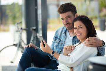 young couple traveler waiting for the bus