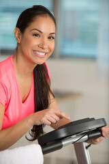 woman setting up her exercise machine