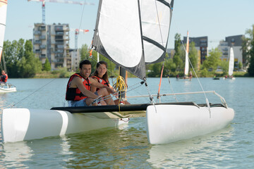 a couple is sailing boat