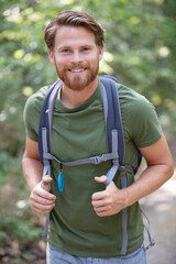 happy male hiker looking at the camera