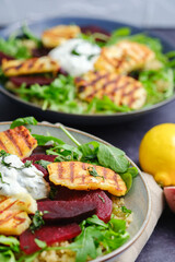 Vegetarian Grilled Halloumi Quinoa Salad with Beetroot. Healthy Mediterranean Food Concept. Vertical Close-up.