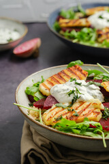 Vegetarian Grilled Halloumi Quinoa Salad with Beetroot. Healthy Mediterranean Food Concept. Vertical Close-up.