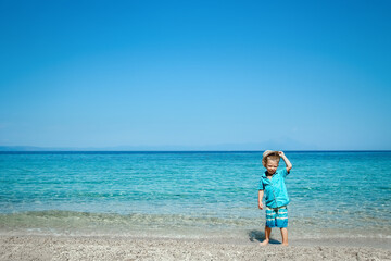 A happy child by the sea in nature weekend travel