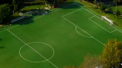 Aerial view of the penalty area on an empty synthetic grass soccer field. 