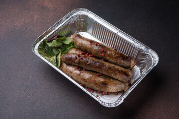 Delivery of delicious sausages. Close up