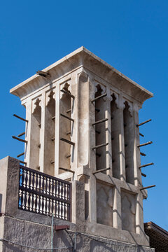 Low angle view of a traditional windcatcher (wind tower, wind scoop), an architectural element to create cross ventilation and passive cooling in buildings in North Africa and around the Persian Gulf 