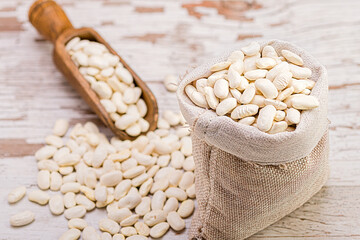 a small sack full of white beans