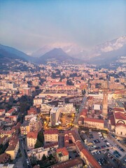 Drone shot of the city of Lecco city and Basilica di San Nicolò, Italy. 