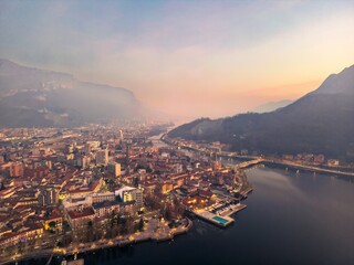 Evening Hues Over Lake Como's Transition into Adda River