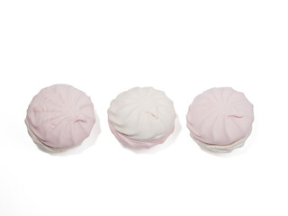 White and pink meringue cookies on a transparent PNG background. Meringue cookies close-up.