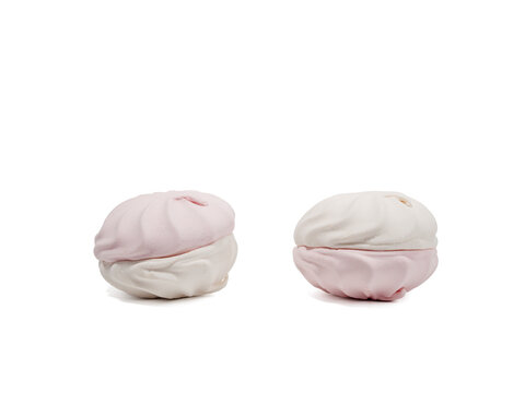 White and pink meringue cookies on a transparent PNG background. Meringue cookies close-up.