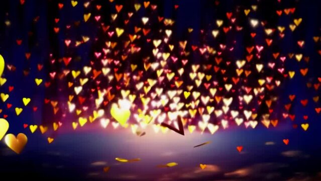 Slowly rising red, yellow, gold colored hearts against the night sky. The heart as a symbol of affection and love.