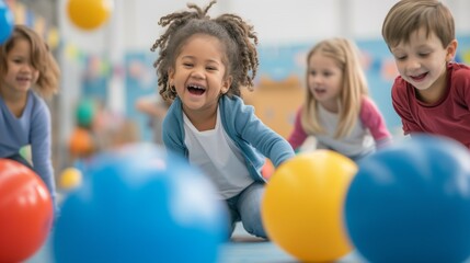 Fototapeta na wymiar Children play with fitness balls in the classroom